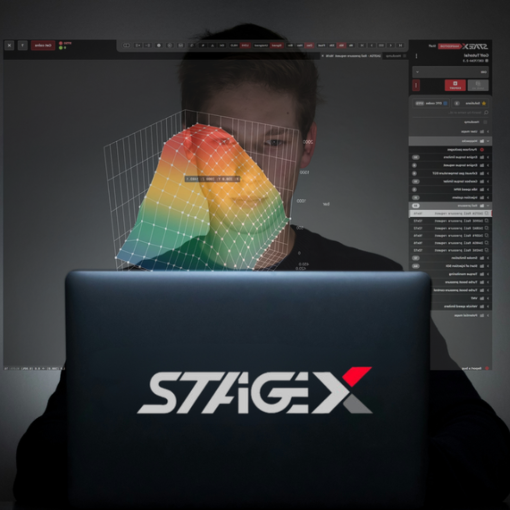 An ECU tuner using Magic Stage X software on a laptop